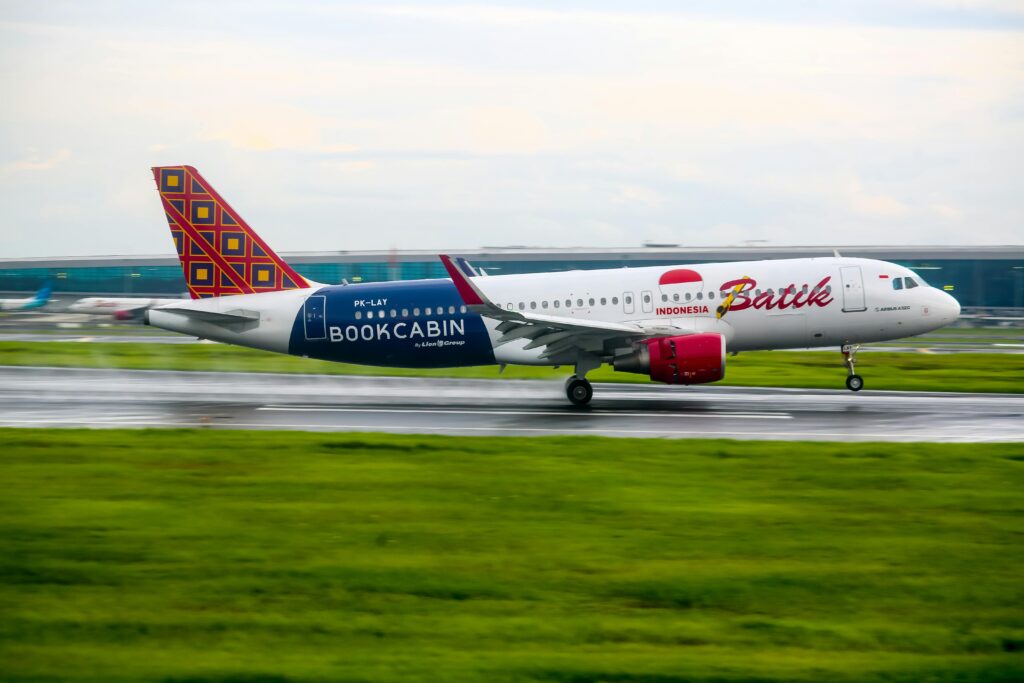 Batik Air Airbus A320 landing on a runway in Banten, Indonesia, showcasing aviation and travel.
